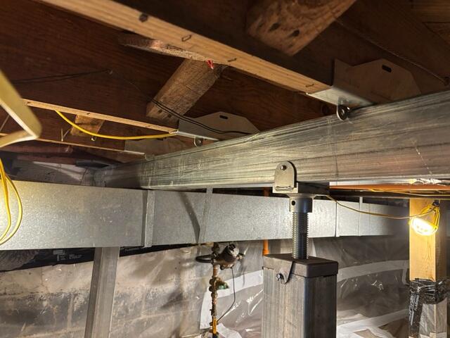 Smart Jacks paired with the Supplemental beams  to support and bring floors back to original position.
