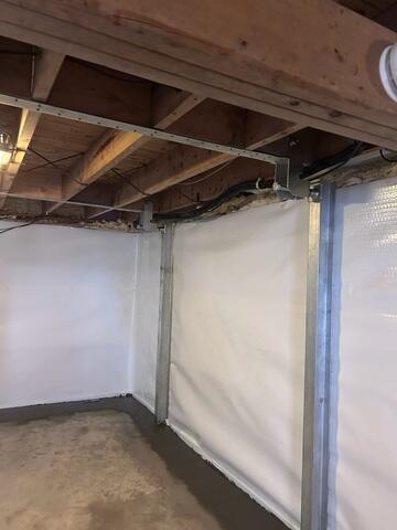 For the structural repair, we installed the PowerBrace wall support system along the affected wall. The system was secured to stabilize the wall immediately and prevent any further inward movement, with the option for future adjustment if needed. Following installation, the basement is now dry, stable, and significantly more functional. Water intrusion has been effectively controlled, even during wet conditions, and the stabilized wall no longer shows signs of ongoing movement.