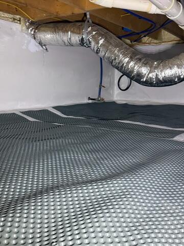 We implemented a drainage solution, with drainage matting, to manage any water entering the crawl space.
