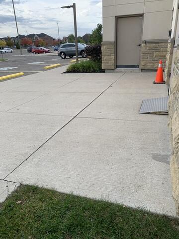 Using precision poly-injection, we lifted the sunken slabs back to a flush, level position. The yellow-marked hazards were permanently neutralized, leaving a safe, AODA-compliant entrance for all church members.