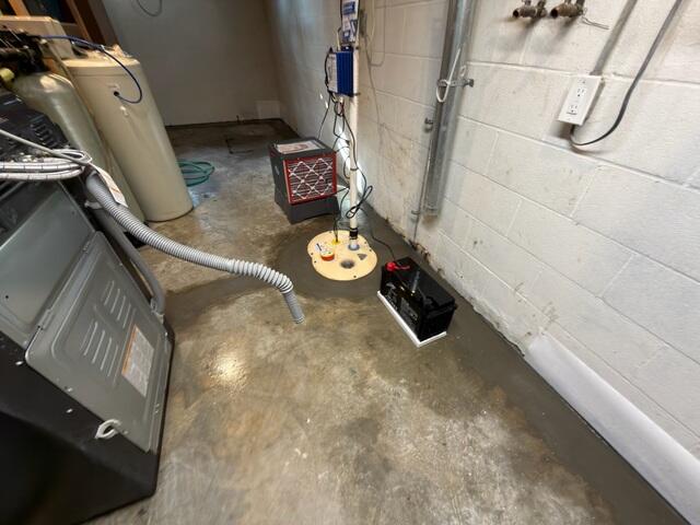 After installing WaterGuard, the crew re-concretes the floor for a seamless, near-invisible finish!