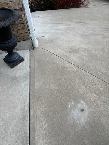 From this angle, you can see how the shifting soil caused the driveway slabs to drop over time, forming gaps and uneven surfaces that posed a safety risk and potential long-term damage.