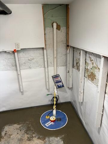 The SuperSump sump pump is now fully installed and ready to handle water intrusion efficiently.