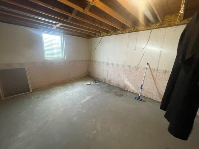 Before: Our Design Specialist, Ryan, suggested securing several waterproofing products throughout the basement.