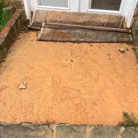 The entryway to the lower level did not have proper drainage solutions to rid the water from coming into the home