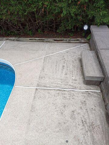 A clear look at the initial settlement. Notice how much the pool deck concrete has sunk by the gap against the back wooden beam and the separation at the porch transition.