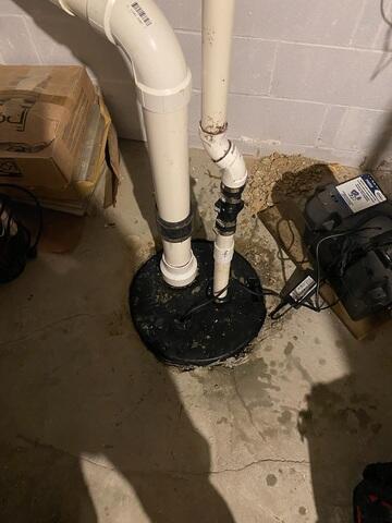 Before: Our Design Specialist, Peter, recommended taking out the old sump pump and replacing it with the TripleSafe.