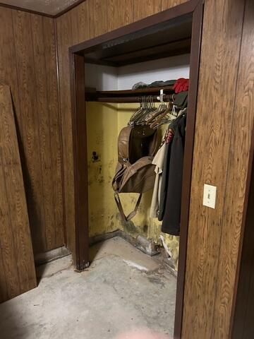 An old bedroom with obvious mold and mildew issues.