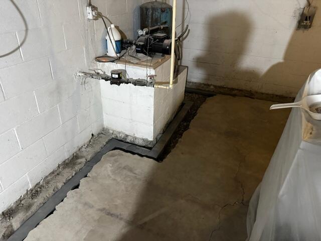 The crew digs a trench around the basement perimeter and installs the WaterGuard drainage pipe. The pipe is pitched toward the sump system to ensure all leaks and flood water is drained out of the basement.