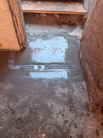 WaterGuard® Interior Drainage System installed along the basement perimeter to intercept water at the point of entry
TrenchDrain™ System placed in key areas to capture surface water before it could spread across the floor