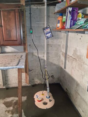 Sump Pump System installed to collect and actively discharge water away from the home in Cuttingsville, Vermont.