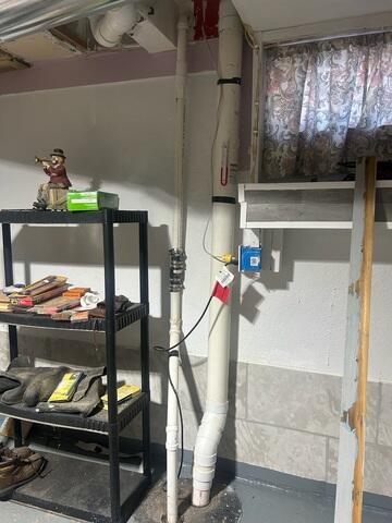 Before: Our Design Specialist, Dylan, recommended waterproofing the walls and replacing the sump pump.
