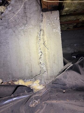 Crack on corner of concrete foundation wall.