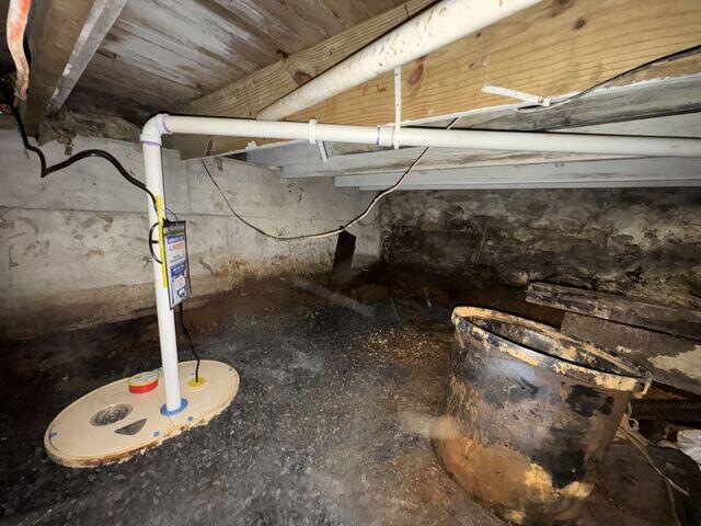 Sump Pump System installed to collect and remove water from the crawl space