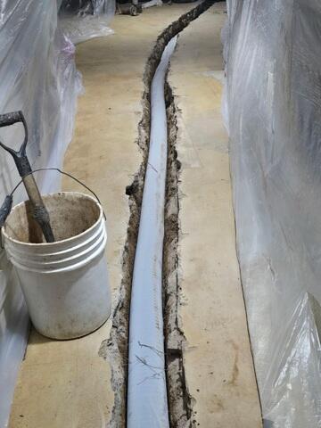 During: Eduardo, our Foreman, and his crew worked hard to secure all the products in the basement.