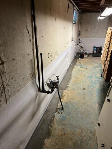 The drainage system is placed beneath the concrete to provide effective protection while maintaining a clean, finished appearance.