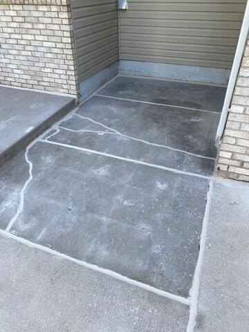 After our crew lifted and leveled the concrete slabs, repaired the cracks, and sealed the joints.