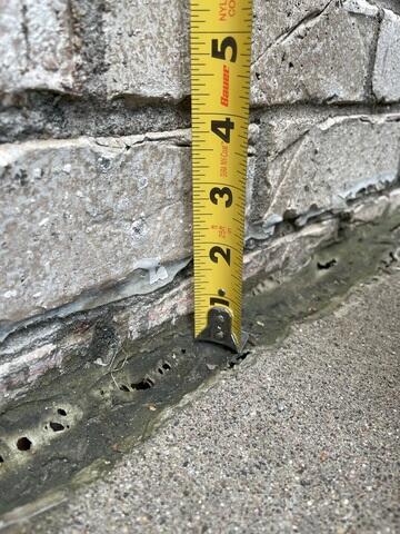 A close up of how far the slabs have sunken