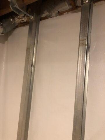 Power brace to stop bowing walls