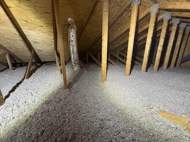 The bath fan routed through the attic with insulated duct
