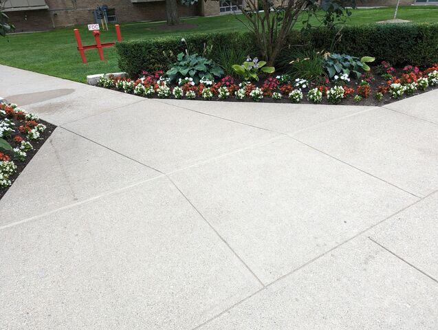 The precision work completed at a complex intersection of garden paths. By stabilizing the soil beneath these high-traffic areas, the slabs now sit perfectly flush, removing the vertical gaps that previously threatened the safety of residents enjoying the outdoor space.