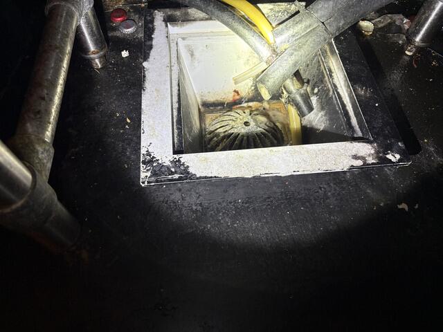As you can see, the floor drain is full of grease, food debris, and other gunk.