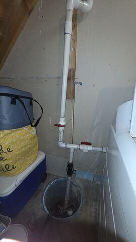 Before: Our Design Specialist, Derek, recommended replacing the out-of-date sump pump.
