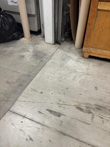 A clean 5/8" injection port drilled near the joint, allowing the polymer to stabilize the floor with minimal footprint.