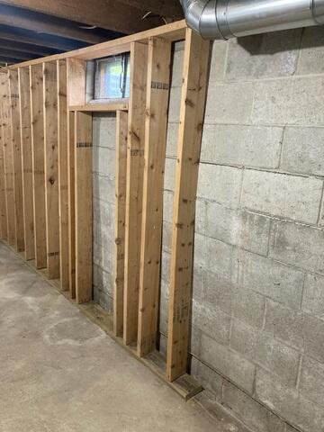 The previous owners had tried a "DIY approach to brace the bowing walls.