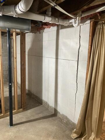 The large cracking in this wall is a sure sign of movement. This should be supported ASAP to prevent further shifting of the foundation walls.