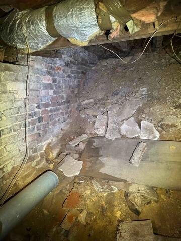 Prior to building the knee wall, the crawl space was little more than a mound of dirt in the basement!