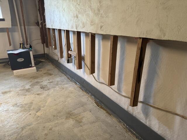 DryTrak is installed along the basement perimeter to capture water before it reaches the floor.