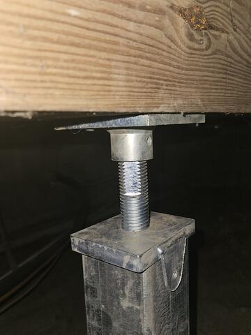 SmartJack installation under the crawlspace.