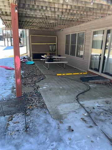 The back porch before our crew lifted and leveled the area