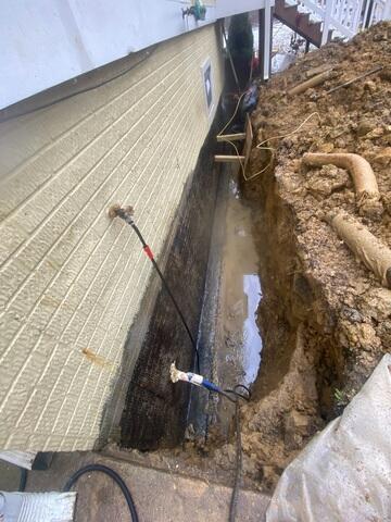 Water pooling next to the foundation of the home in Culpeper, VA after excavation