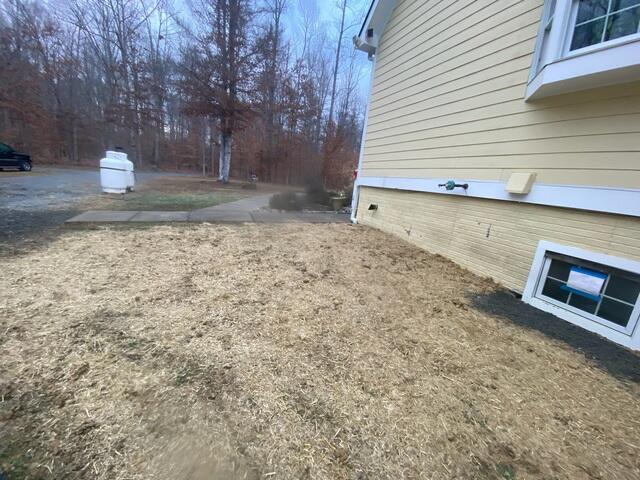 Exterior waterproofing complete with new grass planted.