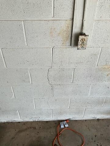 Stairstep cracks in brick or block walls are a common sign of foundation settlement or structural movement. These cracks often follow the mortar joints in a stair-step pattern as the foundation shifts unevenly over time. If left unaddressed, stairstep cracks can worsen and lead to additional structural damage, making early foundation repair important for long-term stability.