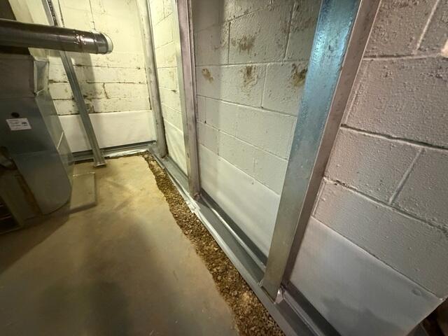 With WaterGuard in place, the crew then installs the static steel I-beams to stabilize the foundation walls.