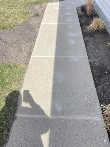 During: Our Foreman, Charlie, and his crew worked hard to secure all the products throughout the sidewalk.