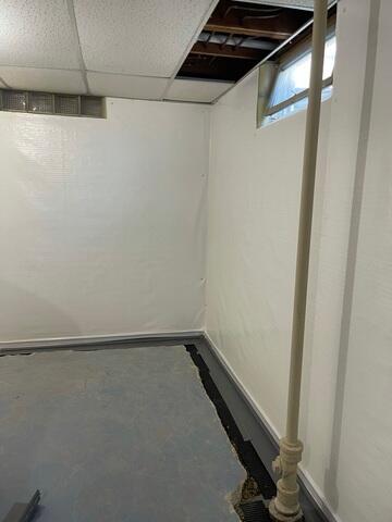 The crew attached CleanSpace to the walls and is in the process on installing WaterGuard at the perimeter