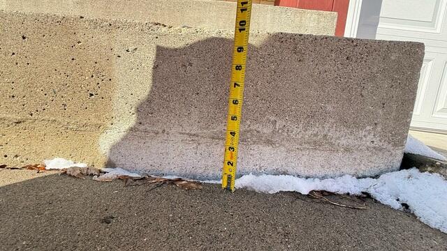 A close up of how far the slabs have sunken from its original position