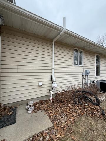 The exterior of the home once the fan and additional piping is installed so that the gas is expelled above the roofline