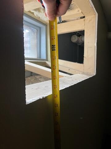 Carson measuring the window frame!