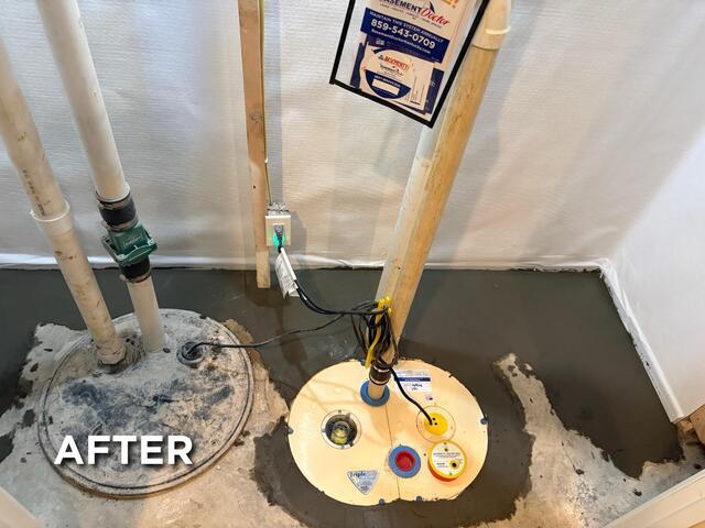 This was what the system looked like after completion. We also wrapped the front alcove room with our white CleanSpace moisture barrier to further protect the room from moisture. We also made sure to replace the discharge line outside the home to ensure the line is properly graded away from the home. This way the discharge line won't allow water to flow back down into the sump pit.