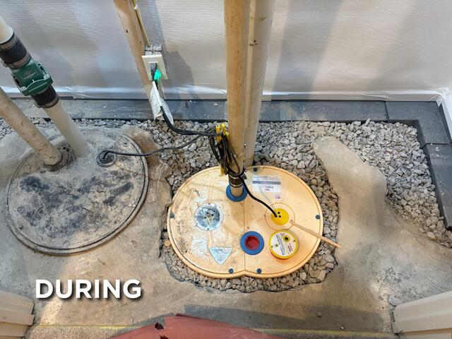 This was what our system looked like half way through the installation. Exterior drainage systems can cause a sump pump system to wear down quickly, as exterior drainage systems channel a lot of dirt and sediment to the sump pit. This dirt can quickly erode the pumps and the mechanics inside the pit. Our SuperSump system will mitigate this issue, as our Zoeller pumps are super durable. We also have pump stands which elevate the Zoeller pumps inside of the pit, clearing them off of the dirty floor in the pit.