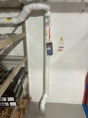 The interior of the home where the piping is installed through the concrete floor in the basement