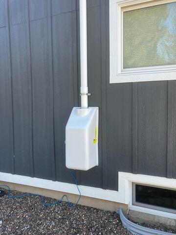 The exterior of the home where our radon mitigation fan is installed