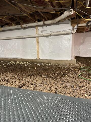 Drainage Matting System - Installed across the crawl space floor to create a separation layer and provide a more even surface