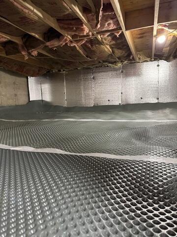 Drainage Matting System - Installed across the crawl space floor to create a separation layer and provide a more even surface