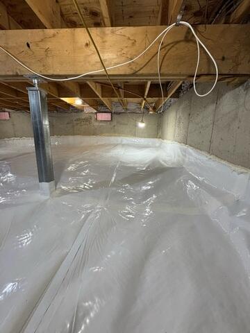 Installed a durable vapor barrier across the entire crawl space floor and along the walls
Installed SmartJack support posts to stabilize and reinforce the structure above